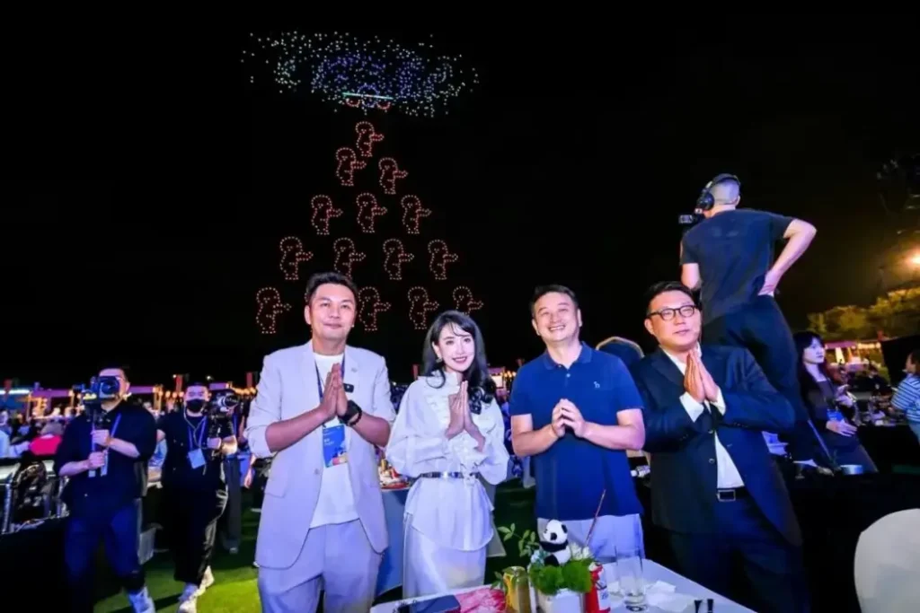 Crostars Chairman Shi Zheyuan watching the drone performance at Trip.com Group Global Partner Gala Chengdu, May 2025