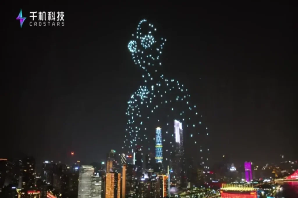 Crostars drone light show night performance forming Ultraman Blazer figure over Guangzhou city skyline, 2023