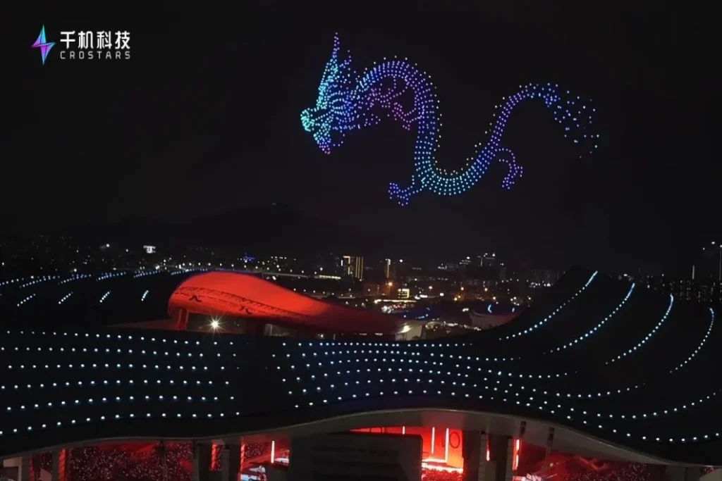 Crostars drones forming a Chinese dragon above Guangdong Olympic Sports Center Stadium at night, Guangzhou, March 2026
